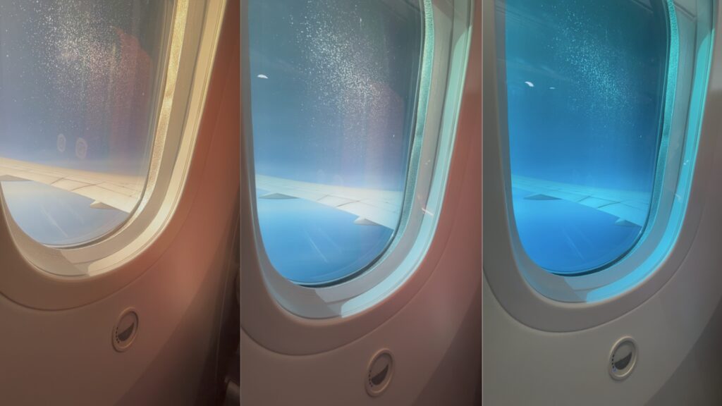 日本航空 JAL Boeing 787-8 經濟艙電控調光窗：取代傳統遮陽板，透過按鈕控制五段式藍色調光，在聖地牙哥直飛東京的日間航程中，柔和過渡光線並維持視野。