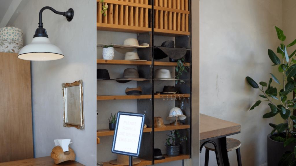 An's Hatmakers 室內全景：羅馬黏土質感牆面上，陳列著各種復古帽飾與木質家具，歐式簡潔風格