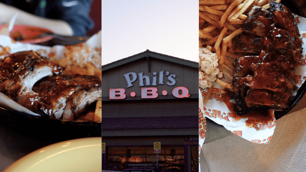 聖地牙哥 Phil's BBQ 餐廳內景與招牌豬肋排餐特寫。金屬托盤上放著一大排塗滿深色濃稠醬汁的 Baby Back Ribs（豬肋排），切面可見明顯的粉紅色煙燻環（Smoke Ring）。旁邊附有高麗菜沙拉（Coleslaw）、薯條與一杯麥根沙士（Root Beer）。背景是熱鬧、人潮眾多的 Point Loma 總店內部，遠處可見點餐櫃檯與大木桌。