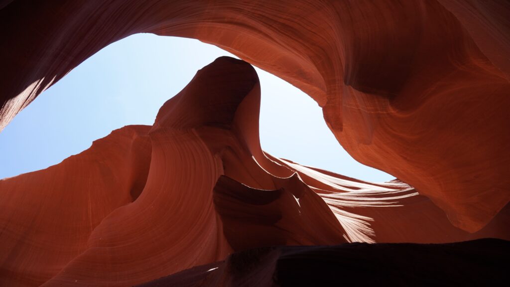 Lower Antelope Canyon slot canyon rock formations with steep metal stairs leading to the flat canyon floor, Page Arizona family road trip guide Lower Antelope Canyon slot canyon rock formations with steep metal stairs leading to the flat canyon floor, Page Arizona family road trip guide